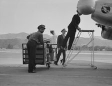 Department of Agriculture plant quarantine inspectors, Glendale Airport, California, 1937. Creator: Dorothea Lange.