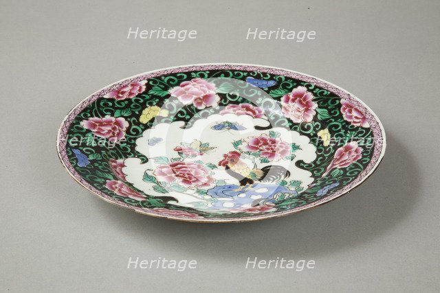 European copy of famille noire plate with cockerel looking at a butterfly, 20th century. Artist: Unknown.