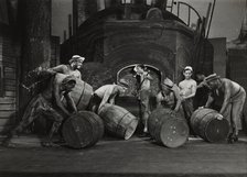Men moving barrels, 1936. Creator: Milton Meltzer.