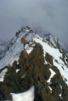Climber on Crib Goch ridge on Snowdon.