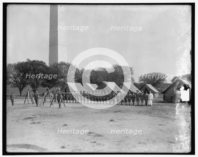 Military camp; base of Washington Monument, between 1910 and 1920. Creator: Harris & Ewing.