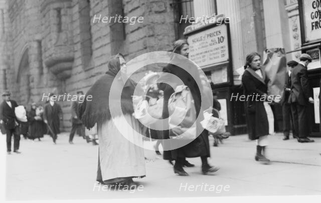 Carrying home Xmas baskets, between c1910 and c1915. Creator: Bain News Service.