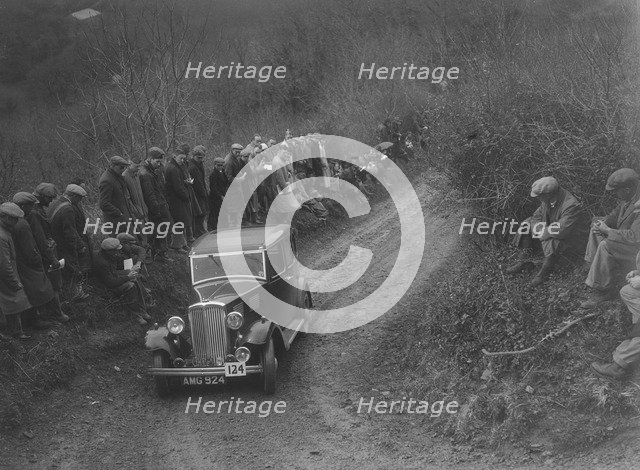 Standard saloon of HF Deane competing in the MCC Lands End Trial, 1935. Artist: Bill Brunell.