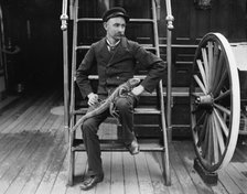 U.S.S. New York, Admiral Sampson's steward and his pet, between 1893 and 1901. Creator: Edward H Hart.