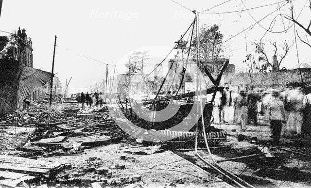 Earthquake damage and a burnt car, King Street, Kingston, Jamaica, 1907. Artist: Unknown
