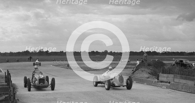 Two MGs racing at Brooklands, Surrey, c1930s. Artist: Bill Brunell.