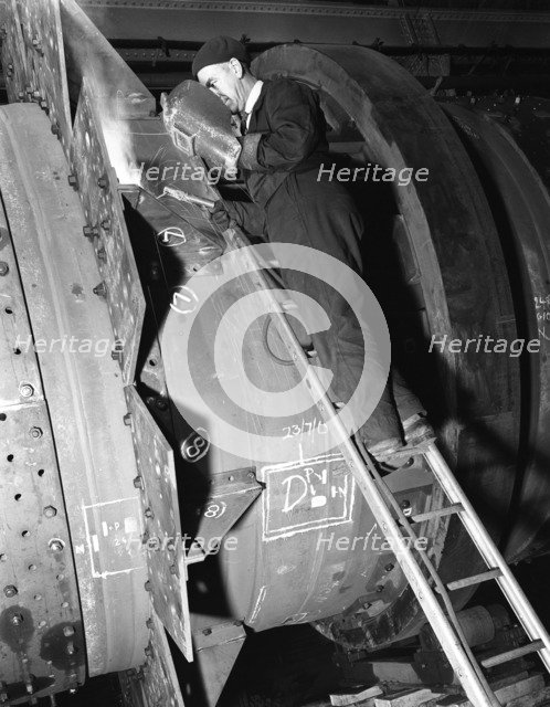 Welding an industrial drying unit, Edgar Allen Steel Co, Sheffield, South Yorkshire, 1962. Artist: Michael Walters