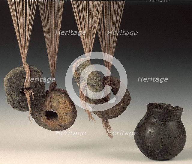 Clay loomweights and pot. Artist: Unknown