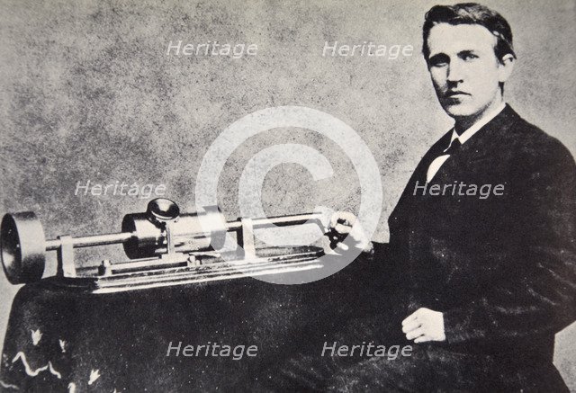 Thomas Alva Edison sitting beside his invention, the phonograph, 1878. Artist: Unknown