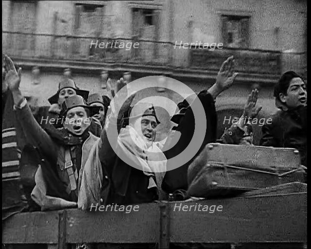 Spanish Fighters on the Back of a Lorry Making Fascist Salutes and Celebrating the Victory..., 1939. Creator: British Pathe Ltd.