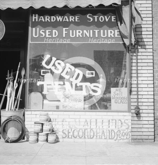 Storefront of San Joaquin Valley town, Fresno, on U.S. 99, California, 1939. Creator: Dorothea Lange.