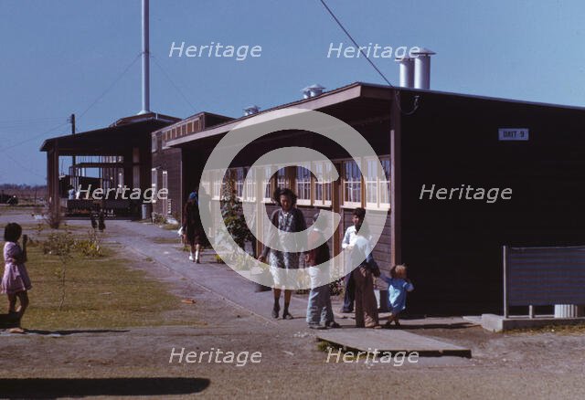 Gardens are planted in front of the row shelters, FSA ... labor camp, Robstown, Tex., 1942. Creator: Arthur Rothstein.