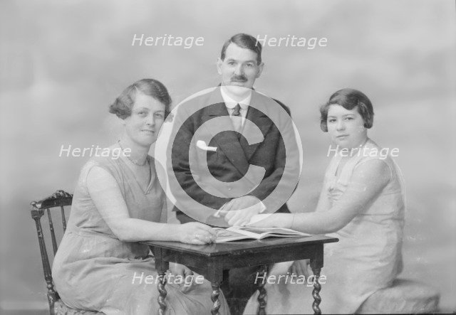 Portrait of two women and a man, c1935. Creator: Kirk & Sons of Cowes.