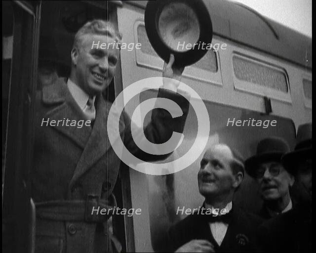 Charlie Chaplin Greeting Onlookers from a Train, 1930s. Creator: British Pathe Ltd.