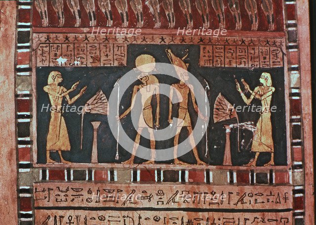 Stela in wood representing the deceased Ba-s-Turefi before the god Atum and Ra-Haharchte, from Th…
