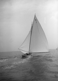 The 7 Metre 'Marsinah' (K1) sailing with spinnaker, 1912. Creator: Kirk & Sons of Cowes.
