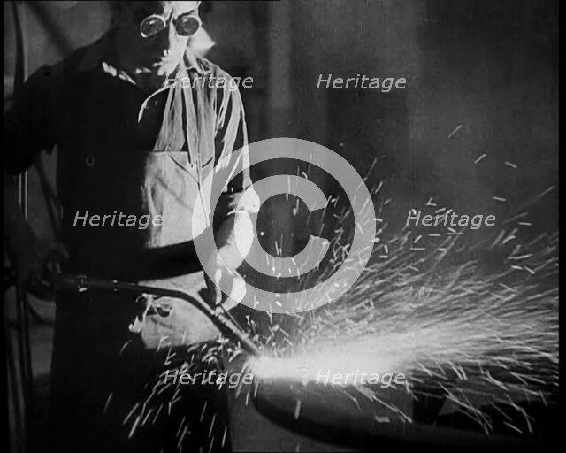 Man Working in a Factory, 1933. Creator: British Pathe Ltd.