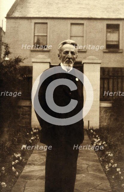 An unidentified man, standing in a garden, c1900. Creator: Unknown.
