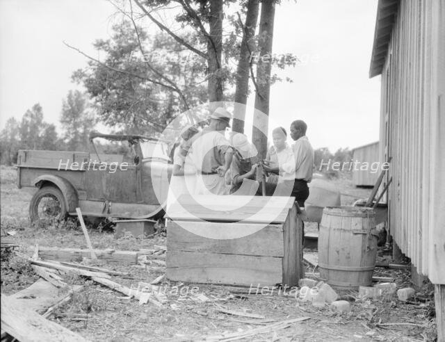 White and blacks solve problems together, Sherwood Eddy cotton cooperative...Mississippi, 1936. Creator: Dorothea Lange.