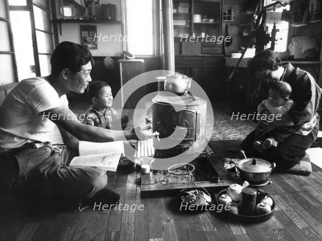 Family relaxing in their living-room, Hokkaido region, Japan, 1963. Artist: Unknown