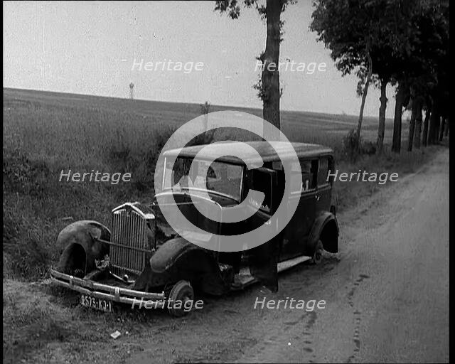 Car Crashed at  the Side of the Road in the French Third Republic, 1940. Creator: British Pathe Ltd.