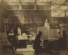 [Storeroom with Artisans and Plaster Casts, Crystal Palace], 1852. Creator: Philip Henry Delamotte.