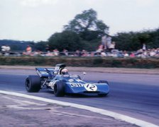 Tyrrell 003 driven by Jackie Stewart in 1971 British GP. Artist: Unknown.