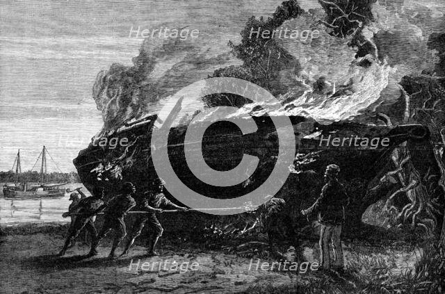 Burning a condemned slave dhow at Funzi, Pemba Island, 1881. Creator: Unknown.