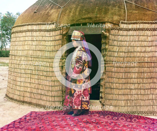 Full-length profile portrait of a woman, possibly Turkman or Kirgiz, standing..., between 1905-1915. Creator: Sergey Mikhaylovich Prokudin-Gorsky.