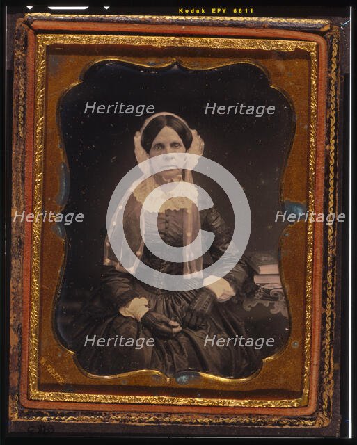 Unidentified woman, three-quarters length portrait, seated with left arm resting..., ca. 1855. Creator: Francis Grice.