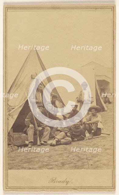 Group of seven soldiers and one black servant at a campsite, about 1862. Creator: Mathew Brady.