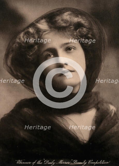 A young woman, winner of a beauty contest, wearing a large black hat with a trailing scarf..., c1904 Creator: Unknown.