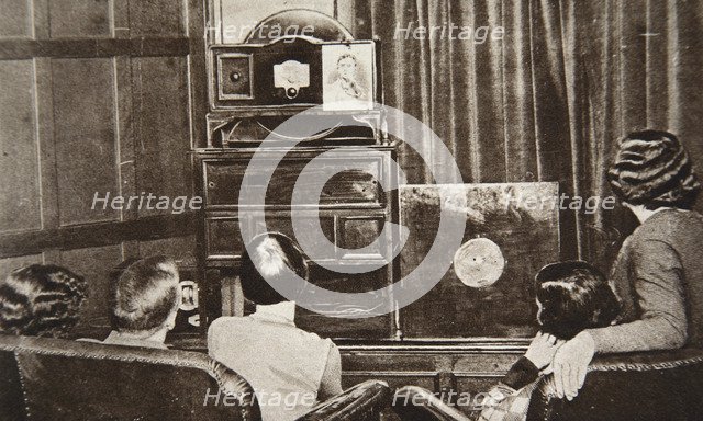 People watching an early television transmission, c1920s. Creator: Unknown.