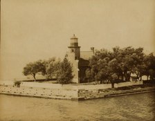 Lighthouse at end of ship canal, St. Clair Lake... near Bayfield, Wisconsin, 1903. Creator: Frances Benjamin Johnston.