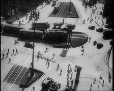 Aerial Shot of a Tram Line with People Walking Around, 1933. Creator: British Pathe Ltd.