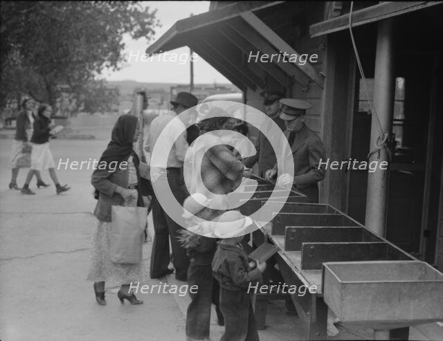Plant quarantine inspectors examining packages, Texas, 1937. Creator: Dorothea Lange.
