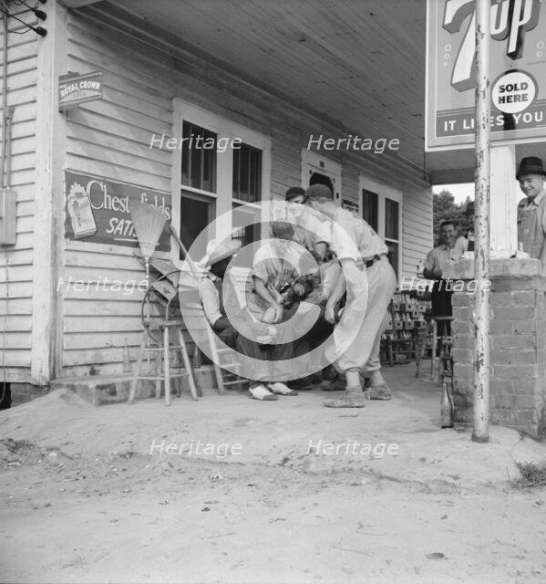 Rural filling station becomes community center..., near Chapel Hill, North Carolina, 1939. Creator: Dorothea Lange.