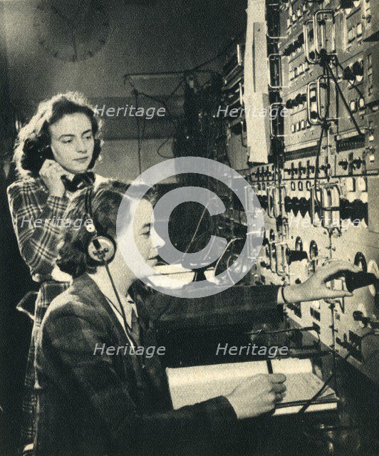 'Women have taken over men's jobs. BBC control room as a programme goes on air' 1942. Creator: Unknown.