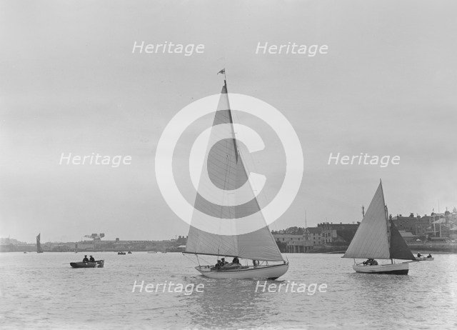 A 5 ton sloop, possibly 'Armonelle', under sail, 1921. Creator: Kirk & Sons of Cowes.