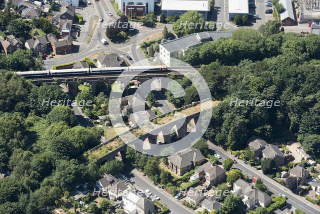 A train crossing a viaduct on the Poole and Bournemouth Railway, Poole, Dorset, 2018. Creator: Historic England.