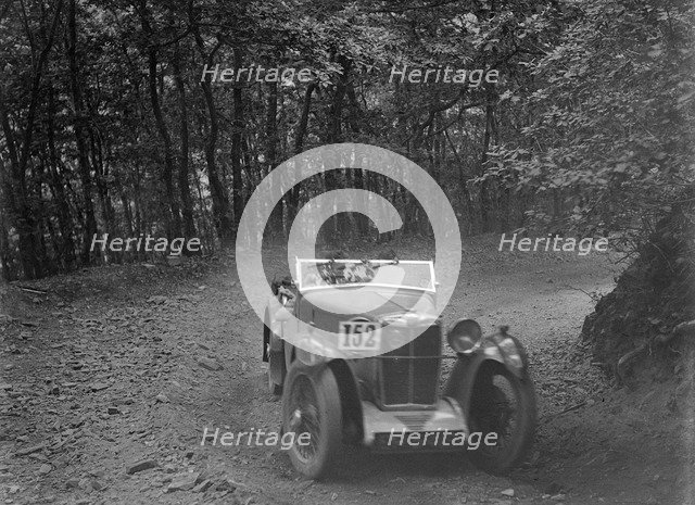 MG Magna competing in the B&HMC Brighton-Beer Trial, Fingle Bridge Hill, Devon, 1934. Artist: Bill Brunell.