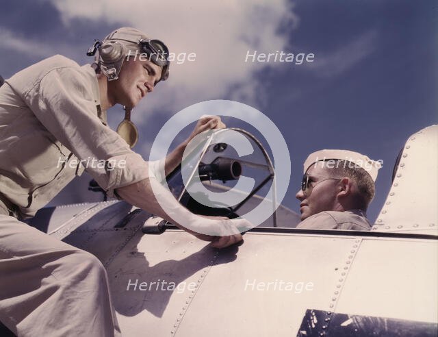 Ensign Noressey and Cadet Thenics at the Naval Air base, Corpus Christi, Texas, 1942. Creator: Howard Hollem.