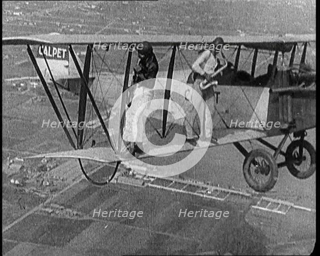 Jazz Musicians Playing from the Wing of a Biplane in the Air, 1921. Creator: British Pathe Ltd.