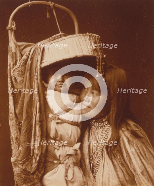 Apache girl and papoose, c1903. Creator: Edward Sheriff Curtis.