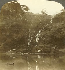 'Farmhouses of Yri nestled at the mountain's base - Yri falls on the glacier, Norway', c1905. Creator: Unknown.