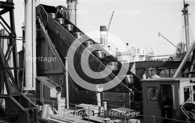 Detail of a dredger at work in Tilbury Docks, Essex, c1945-c1965. Artist: SW Rawlings