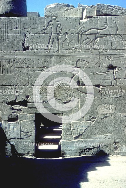 Relief of the Pharoah in chariot riding down his enemies, Temple of Amun, Karnak, c14th century BC. Artist: Unknown