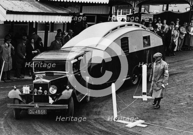 1930 Morris Oxford Six with Winchester Streamline caravan. Creator: Unknown.