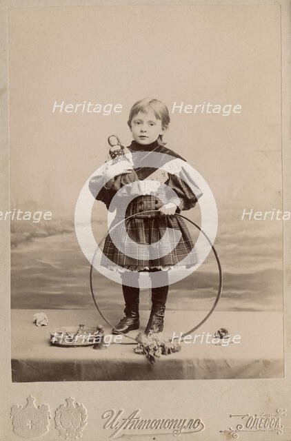 Portrait of a girl with a hoop and a doll, 1900. Creator: I. Antonopulo.