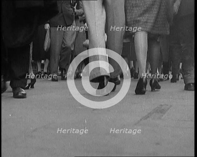 The Shoes and Legs of Crowds of People Walking the Streets of London, 1929. Creator: British Pathe Ltd.